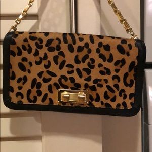 BCBG MAXAZRIA leopard clutch, gold front closure.